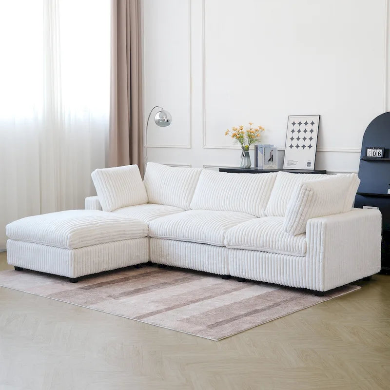 Canapé d'angle moderne en tissu polyester avec pouf, en forme de L.