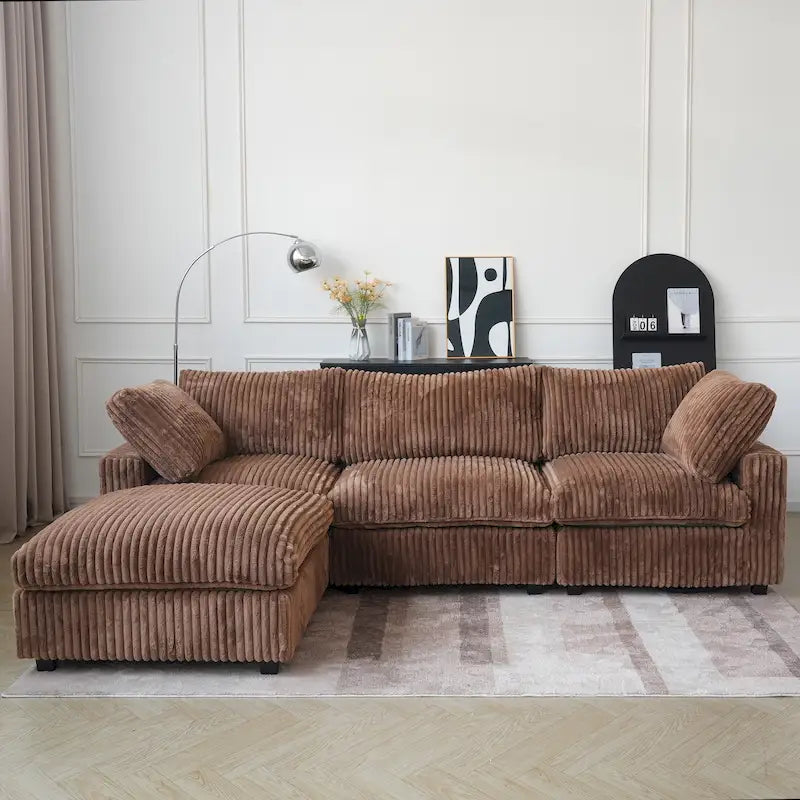 Canapé d'angle moderne en tissu polyester avec pouf, en forme de L.