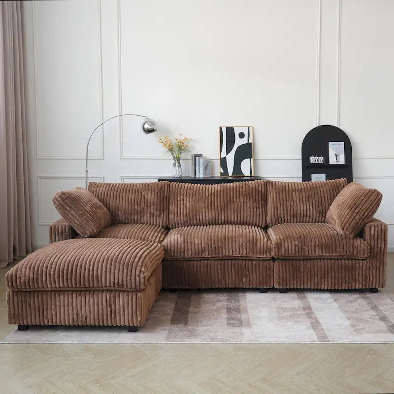 Canapé d'angle moderne en tissu polyester avec pouf, en forme de L.