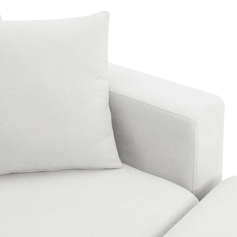 Canapé d'angle moderne en tissu polyester avec pouf, en forme de L.