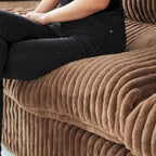 Canapé d'angle moderne en tissu polyester avec pouf, en forme de L.